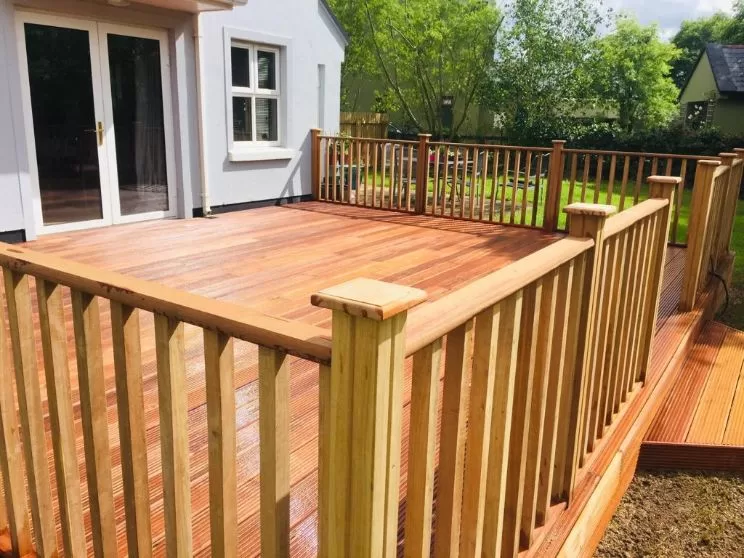 Hardwood decking with timber fencing around perimeter